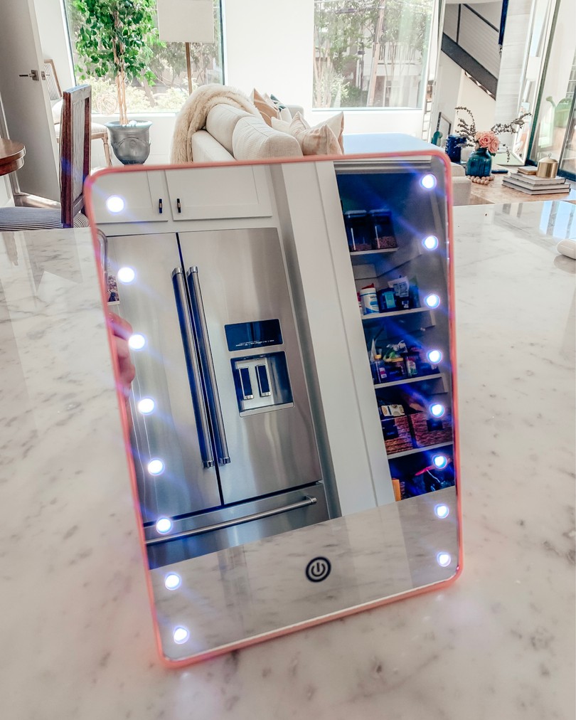 pink lighted travel mirror